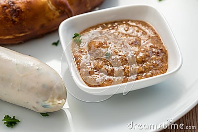 Bavarian sweet mustard with German Munich WeiÃŸwurst sausage and pretzel Stock Photo